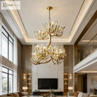 Statement crystal chandelier with gold-toned branch frame and clear prism accents