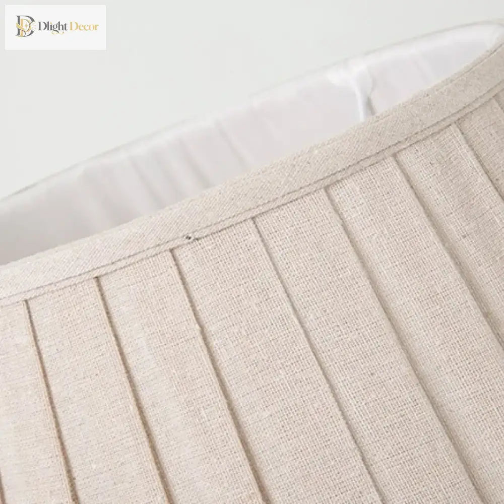 Beige fabric lampshade panel with stitched pleats and textured weave