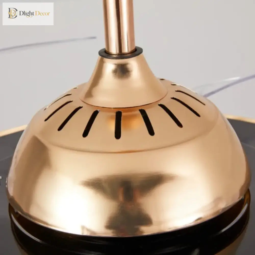 Close-up of gold ceiling fan motor housing with vented top plate