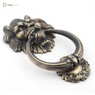 Bronze lion head door knocker with curved ring and filigree ornament, antique finish