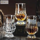 Set of three faceted crystal whiskey tasting glasses with clear stems and star-cut bowls
