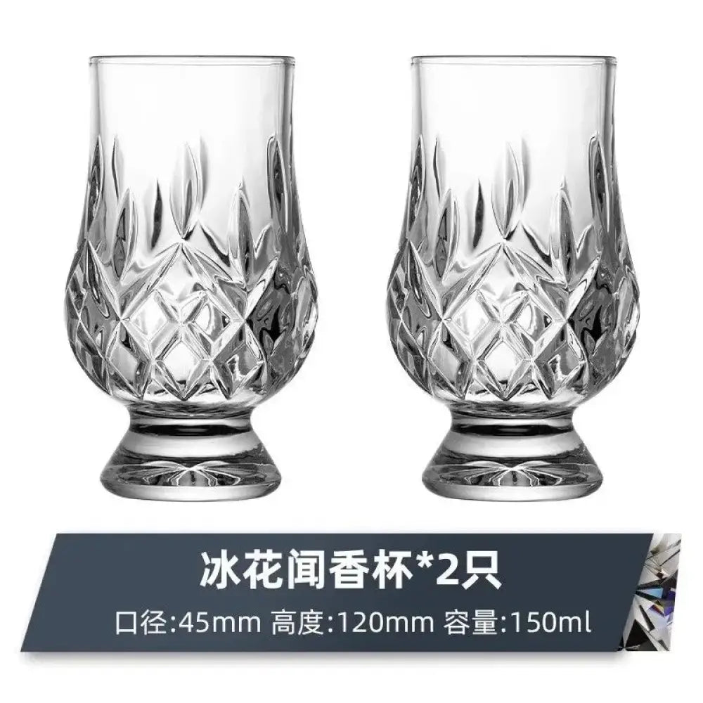 Clear faceted crystal whiskey tasting glass with diamond pattern and flared base