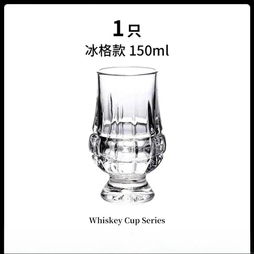 Clear faceted crystal whiskey tasting glass with geometric base and straight-sided bowl