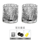 Two hammered crystal rocks glasses shown together in a gift set layout.