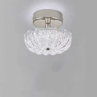 Chrome flush-mount ceiling light with clear crystal-style acrylic drum shade