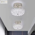 Chrome flush-mount ceiling light with clear crystal-style acrylic drum shade