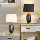 Ceramic LED desk lamp with navy-blue honeycomb base and black pleated shade