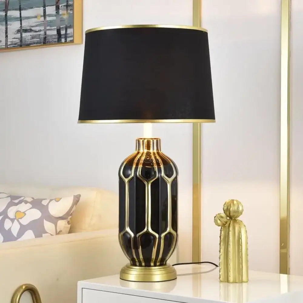 Ceramic LED desk lamp with black shade and dark gold honeycomb ceramic base