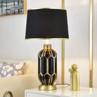 Ceramic LED desk lamp with black shade and dark gold honeycomb ceramic base