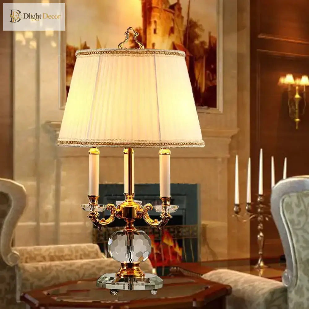 Crystal LED desk lamp with gold candelabra-style arms and white drum shade