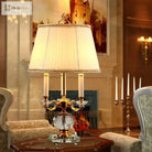 Crystal LED desk lamp with gold candelabra-style arms and white drum shade