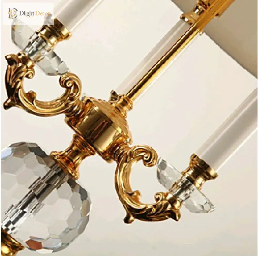 Gold metal crystal desk lamp with ornate arms and clear glass crystal details