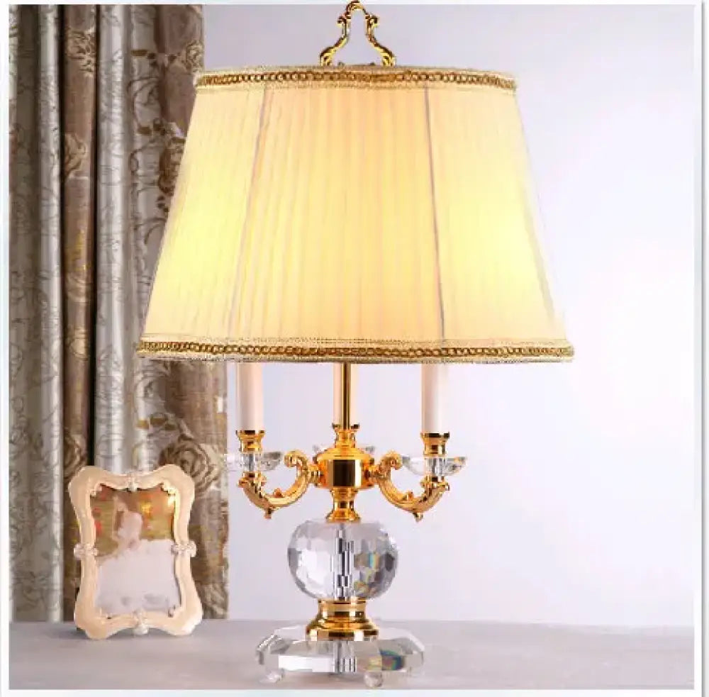 Modern crystal LED desk lamp with gold base and white drum shade