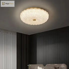 Small round crystal-style acrylic LED flush-mount ceiling light with brass center