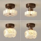 Brown flush-mount LED ceiling light with frosted glass shades and round canopy