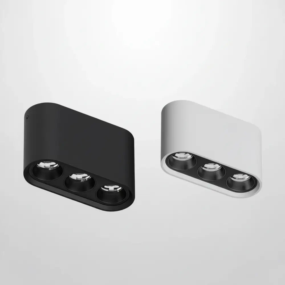 Linear surface-mounted LED ceiling spotlight, black and white housings with three spots