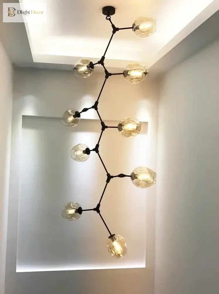 Black molecular glass chandelier with clear glass globe lights, ceiling-mounted