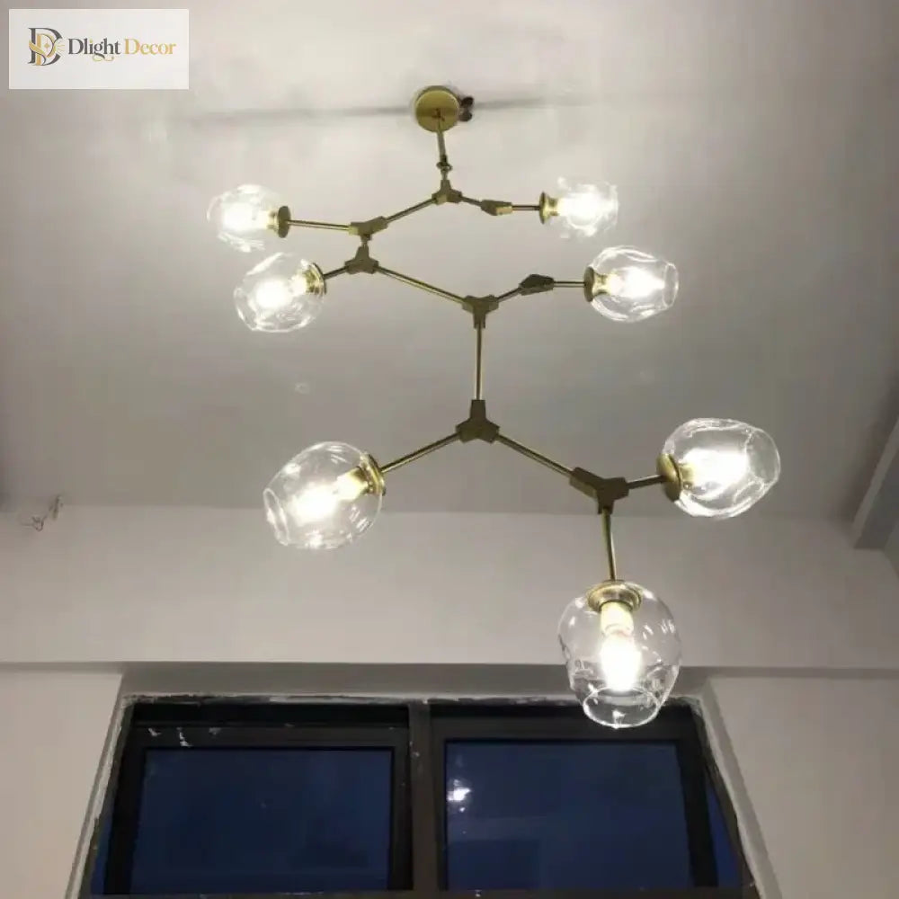 Gold molecular glass chandelier with multiple clear glass globe lights, overhead view