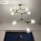 Gold molecular glass chandelier with multiple clear glass globe lights, overhead view