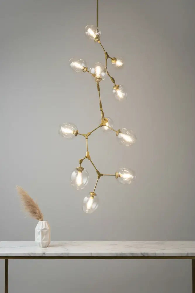 Gold molecular glass chandelier with clear globe lights and ceiling mount