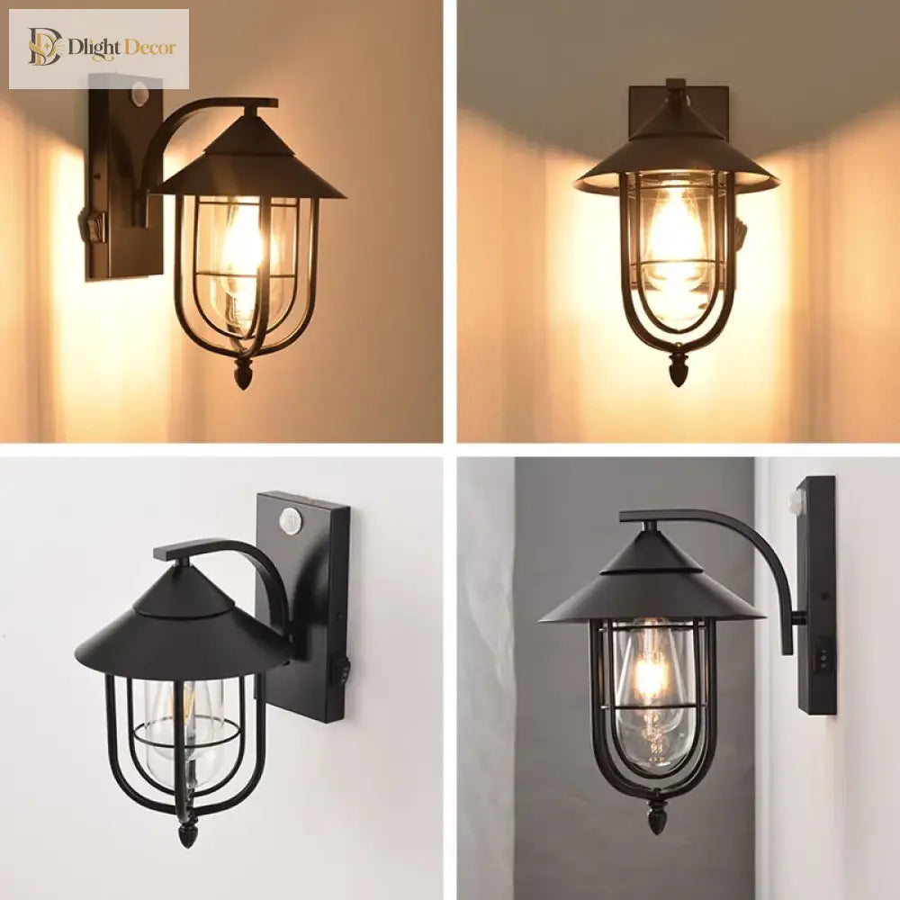 Outdoor wall lantern light showing black finish with clear glass cylinder bulb