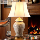 Neoclassical LED desk lamp with ivory shade and ornate floral ceramic body, gold trim