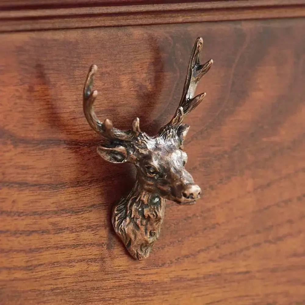 Antique-style deer head cabinet knob with detailed antlers