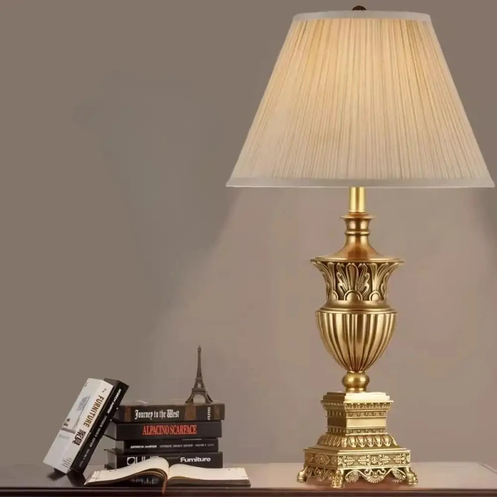 LED desk lamp with beige pleated fabric shade and ornate gold base