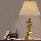 LED desk lamp with beige pleated fabric shade and ornate gold base