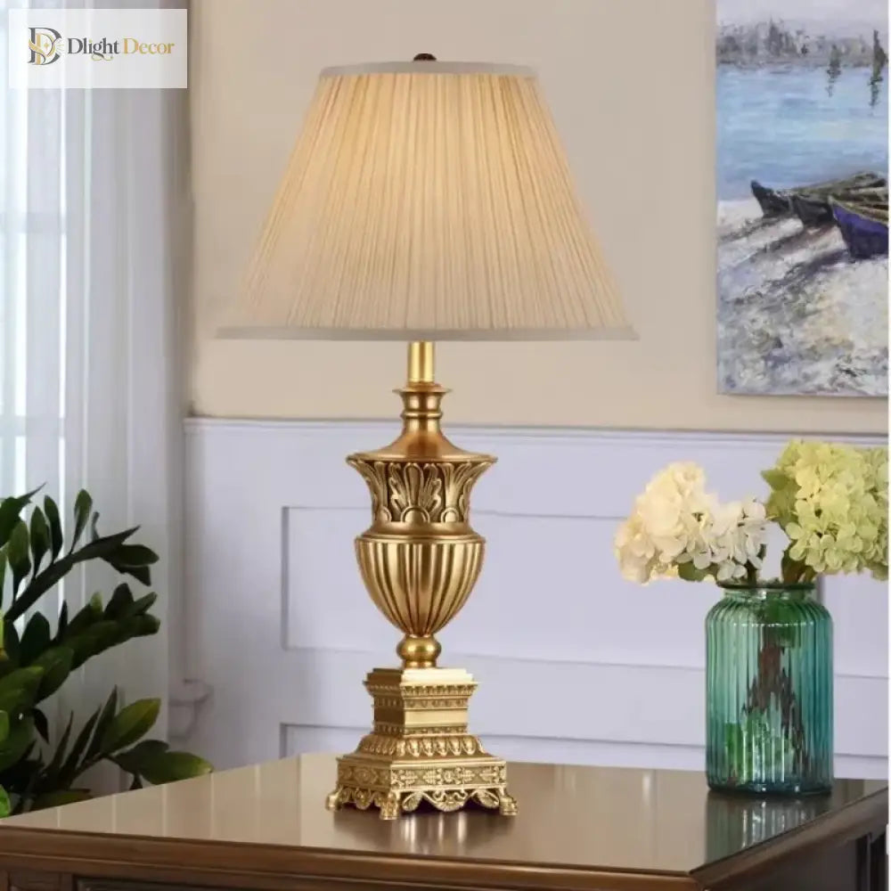 LED desk lamp with beige pleated shade and decorative gold base