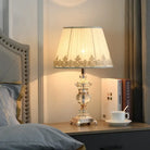 Retro crystal desk lamp with pleated white shade and ornate silver base