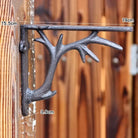 Retro iron triangle shelf bracket with size markings, dark metal, wall-mounted support