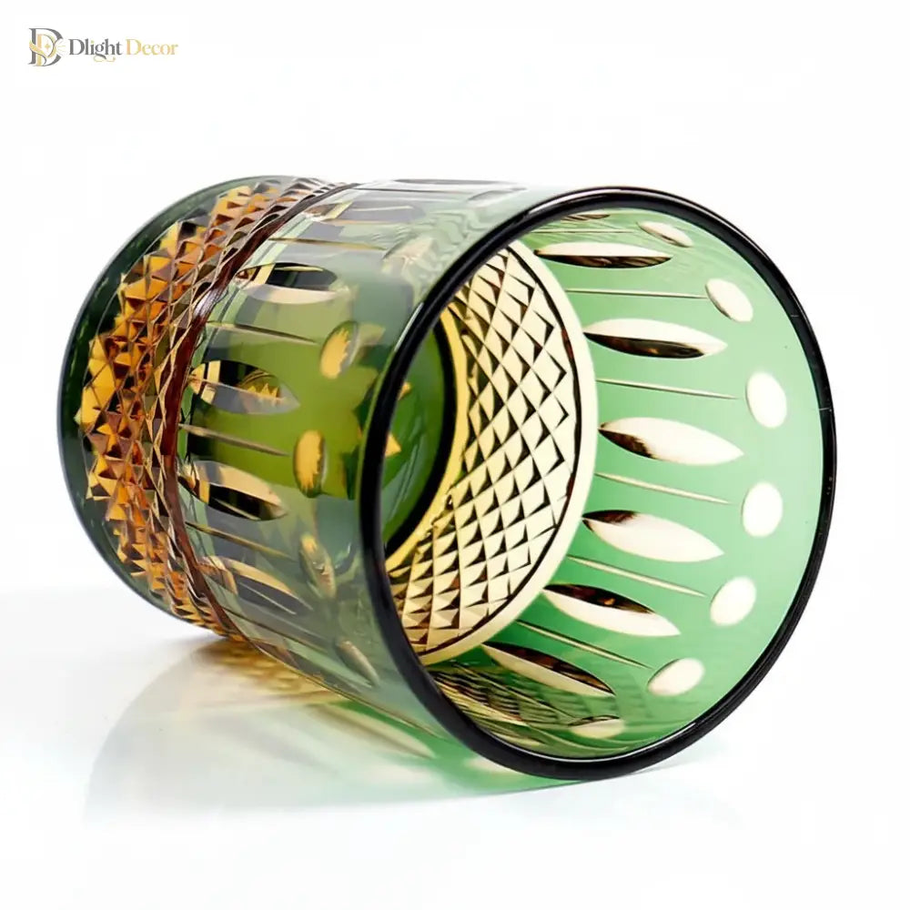 Green diamond-cut crystal whiskey glass, side view with raised faceted pattern