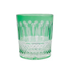 Green diamond-cut crystal whiskey glass with faceted lower section