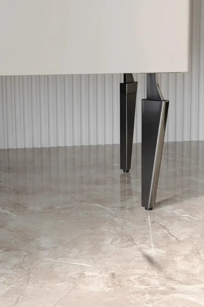 Black half-curved adjustable furniture legs, set of 4, supporting a cabinet corner