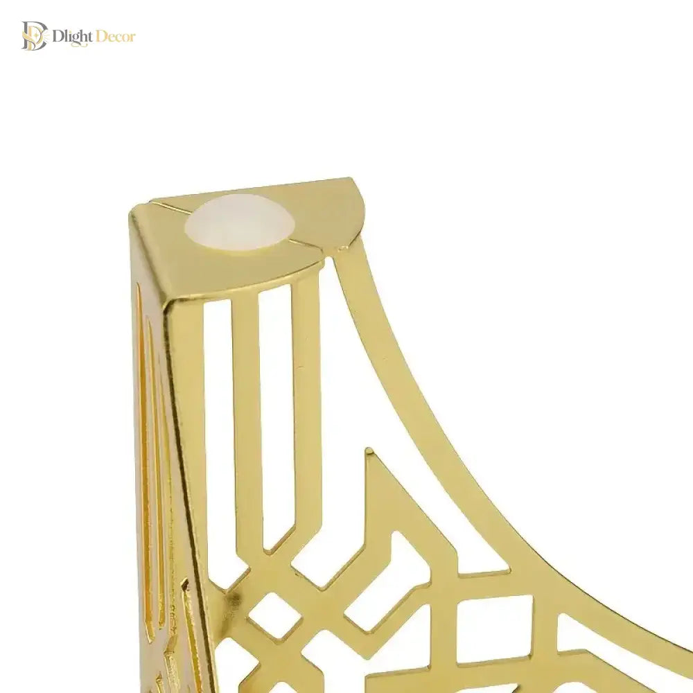 Gold-tone metal furniture leg close-up showing round mounting hole on top