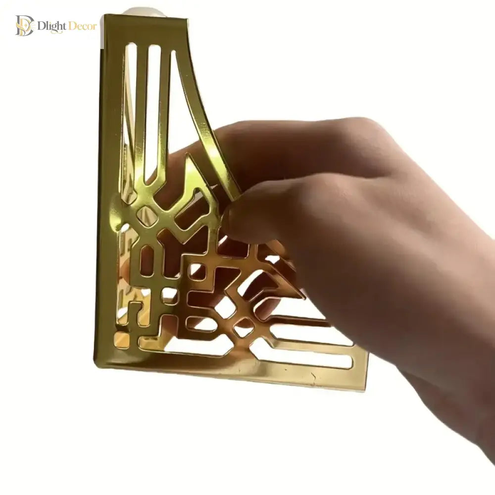 Gold-tone metal furniture leg corner bracket with geometric lattice and mounting holes