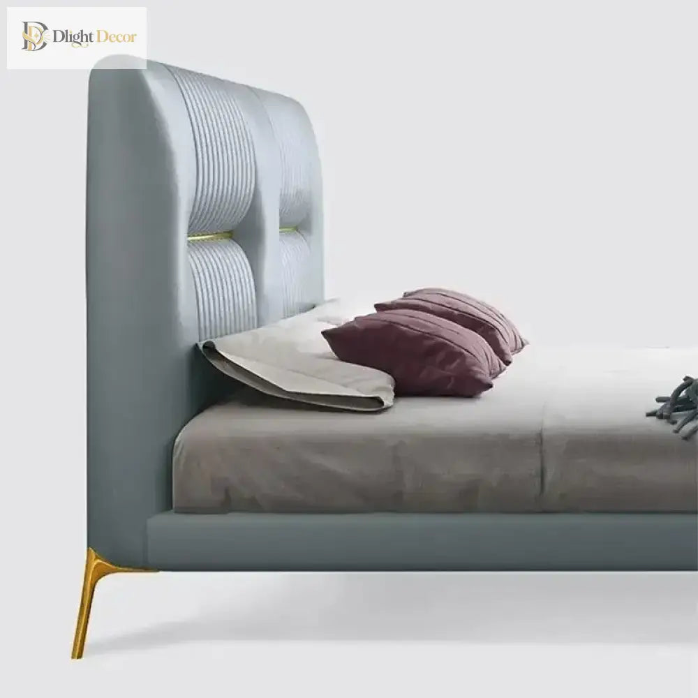 Gold stainless steel furniture leg with rubber protector on upholstered bed frame