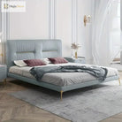 Gold stainless steel furniture legs with rubber protectors supporting a upholstered bed
