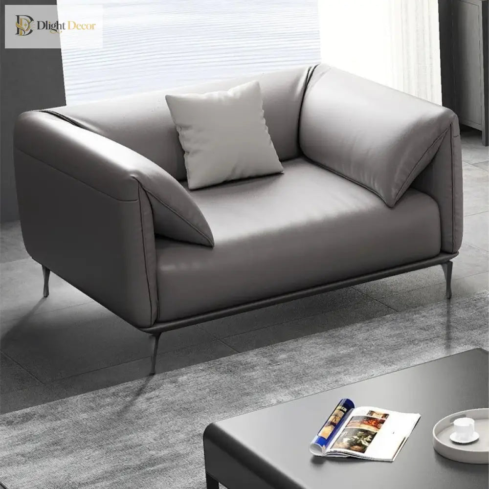 Dark metal furniture legs under a grey sofa