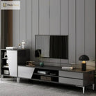Metal furniture legs supporting a TV stand, with a visible cabinet leg set
