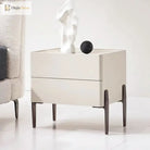 Dark metal furniture leg with slender post and open mounting bracket on cabinet