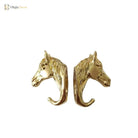Solid brass horse head cabinet knob pair, front view with curved hook ends