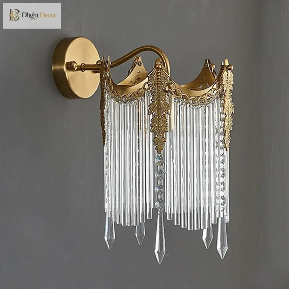 Gold crystal wall sconce with scalloped crown top and clear crystal drops