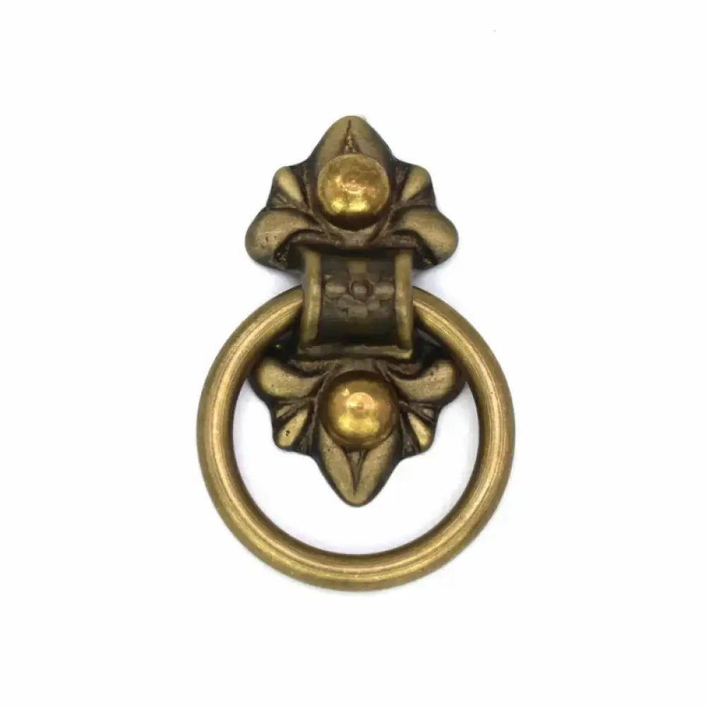 Solid brass ring door knocker pull with ornate floral cross design and loop handle