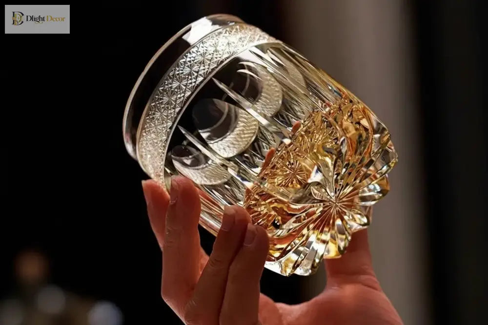Amber cut crystal whiskey tumbler with starburst pattern and scalloped rim