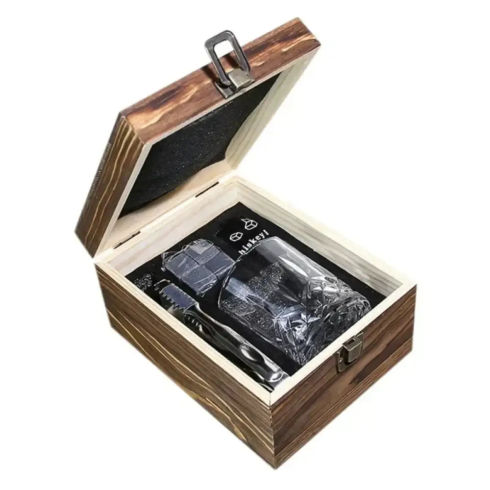 Closed wooden gift box with two whiskey glasses, chilling stones, and included tongs