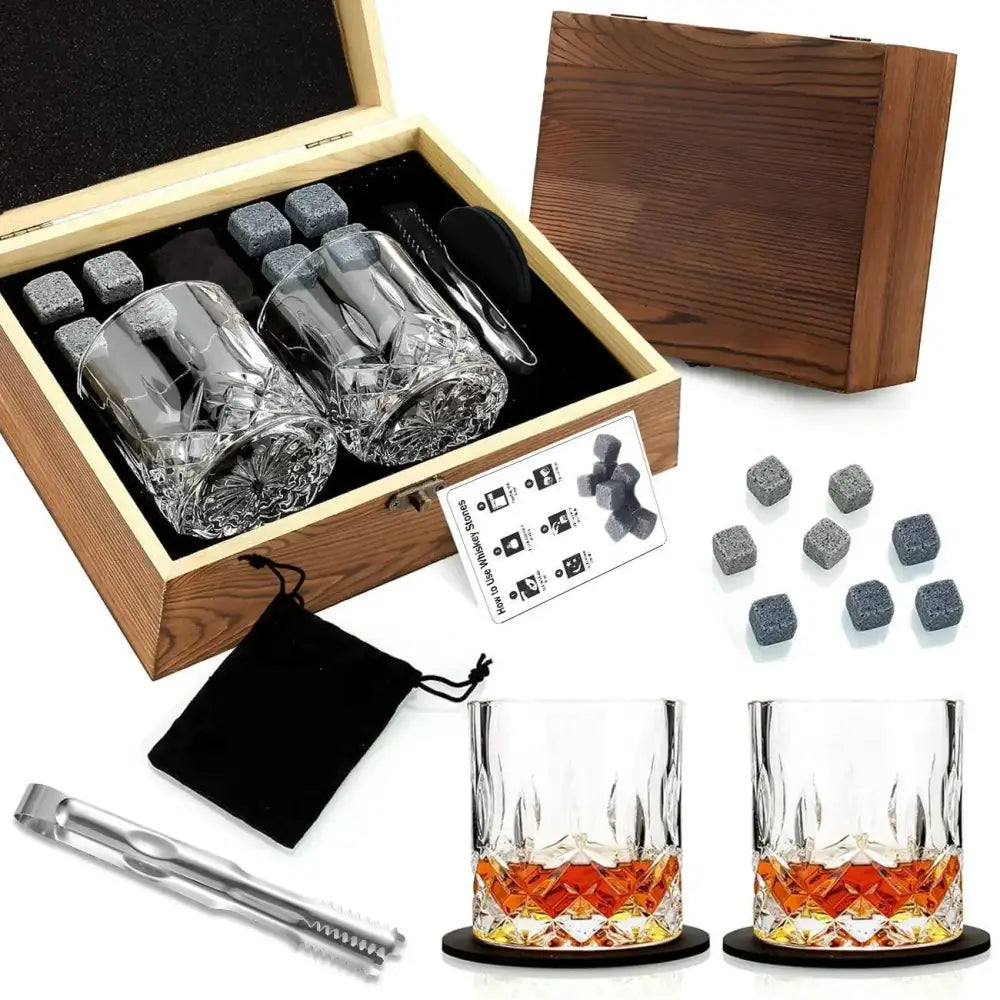 Open whiskey gift set box with two glasses, chilling stones, tongs, and black storage pouch
