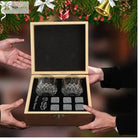 Granite chilling rocks set in wooden box with two faceted whiskey glasses