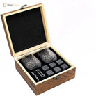 Faceted whiskey glasses and granite cube rocks in a wooden gift box